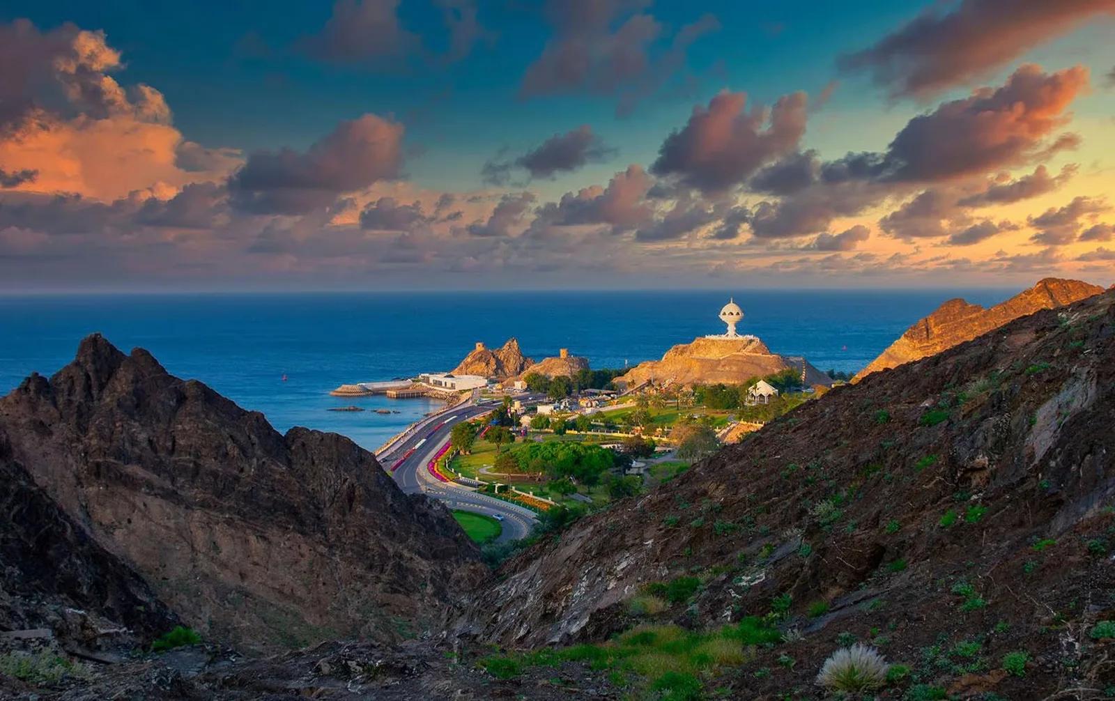 Muscat coastal roads and waterfront at dusk